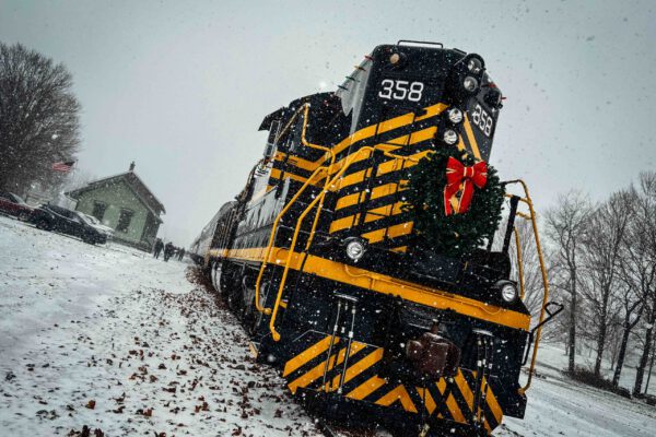 Angle of NKP 358 and Station in Pleasant Lake during Christmas Trains
