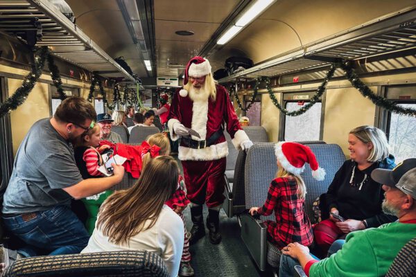 Santa Arrives to Greet Guests inside Christmas Train